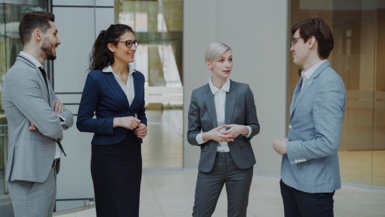 Business professionals meeting in a modern office lobby