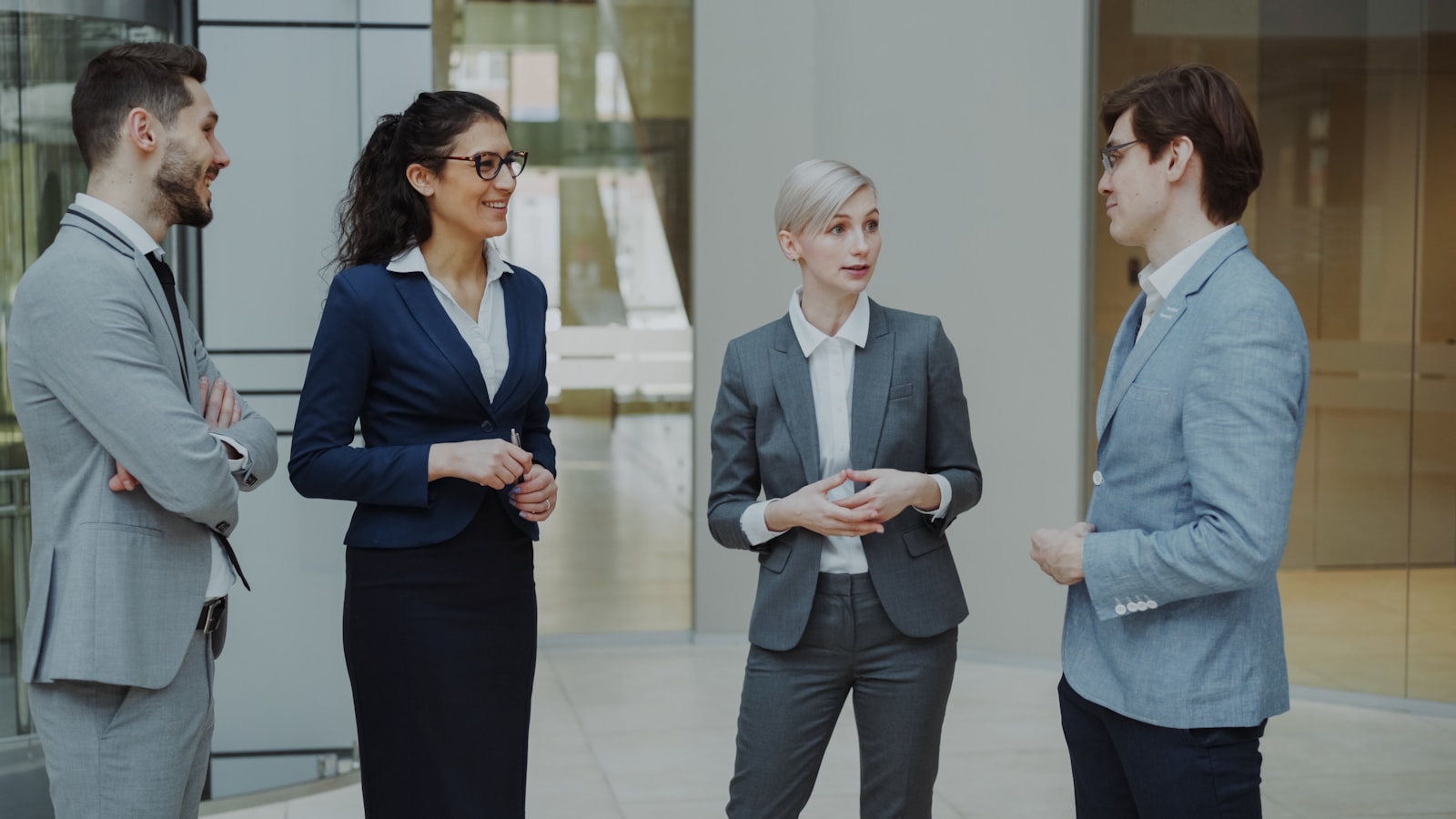 Business professionals meeting in a modern office lobby