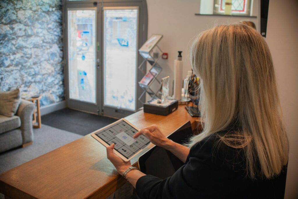 Receptionist using a tablet for digital visitor management