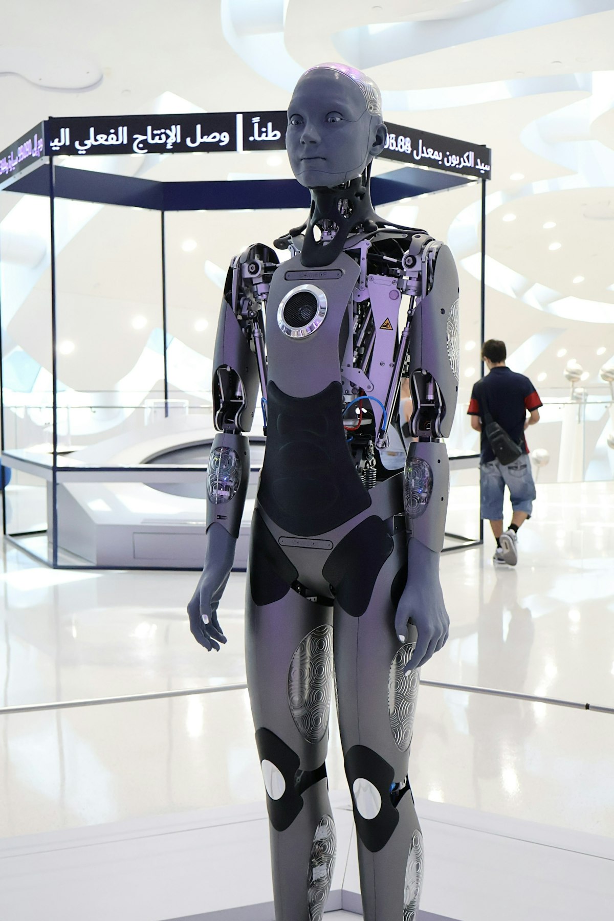 Humanoid robot displayed in a bright museum exhibition hall